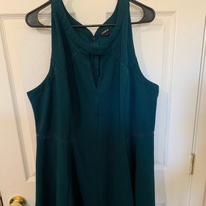 This is a pretty teal colored short dress!